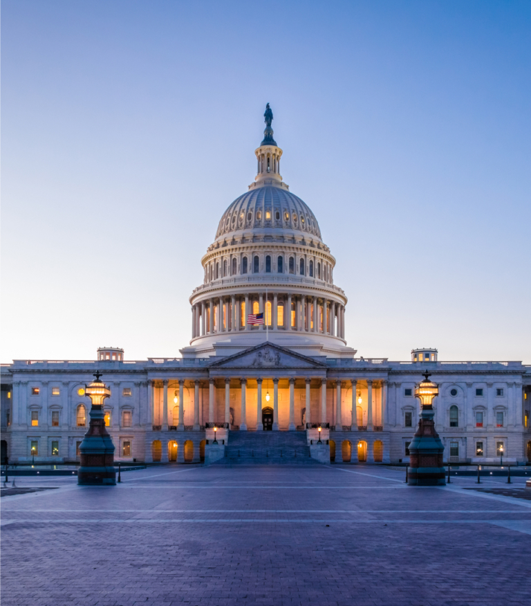 A front view of the U.S. Capitol Building at sunrise